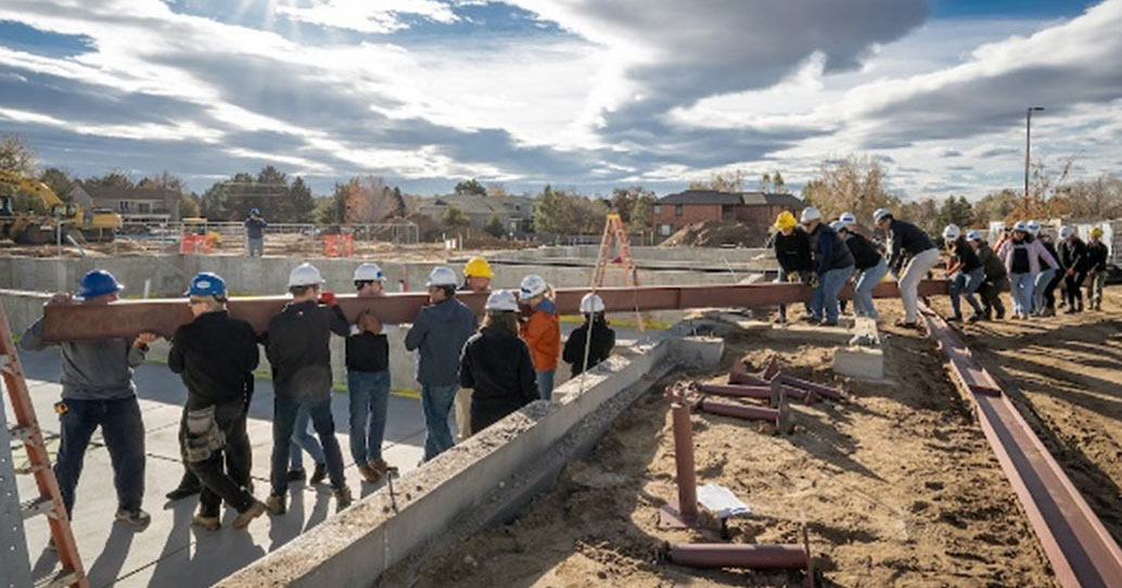 volunteers for Habitat f Humanity are building the house together.