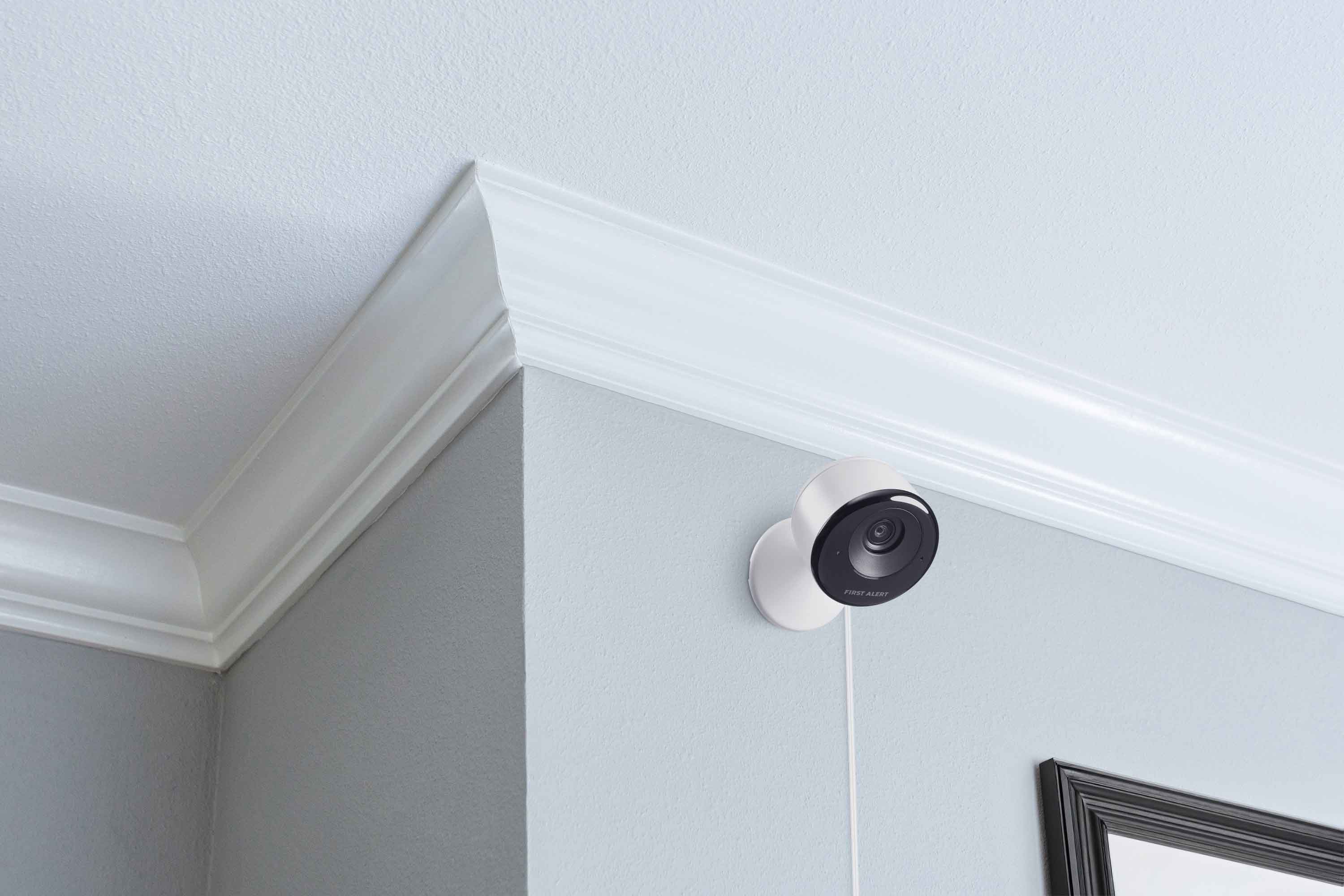 A VX5 Indoor Camera mounted on a wall in a home.